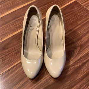 Cream closed toed shoes